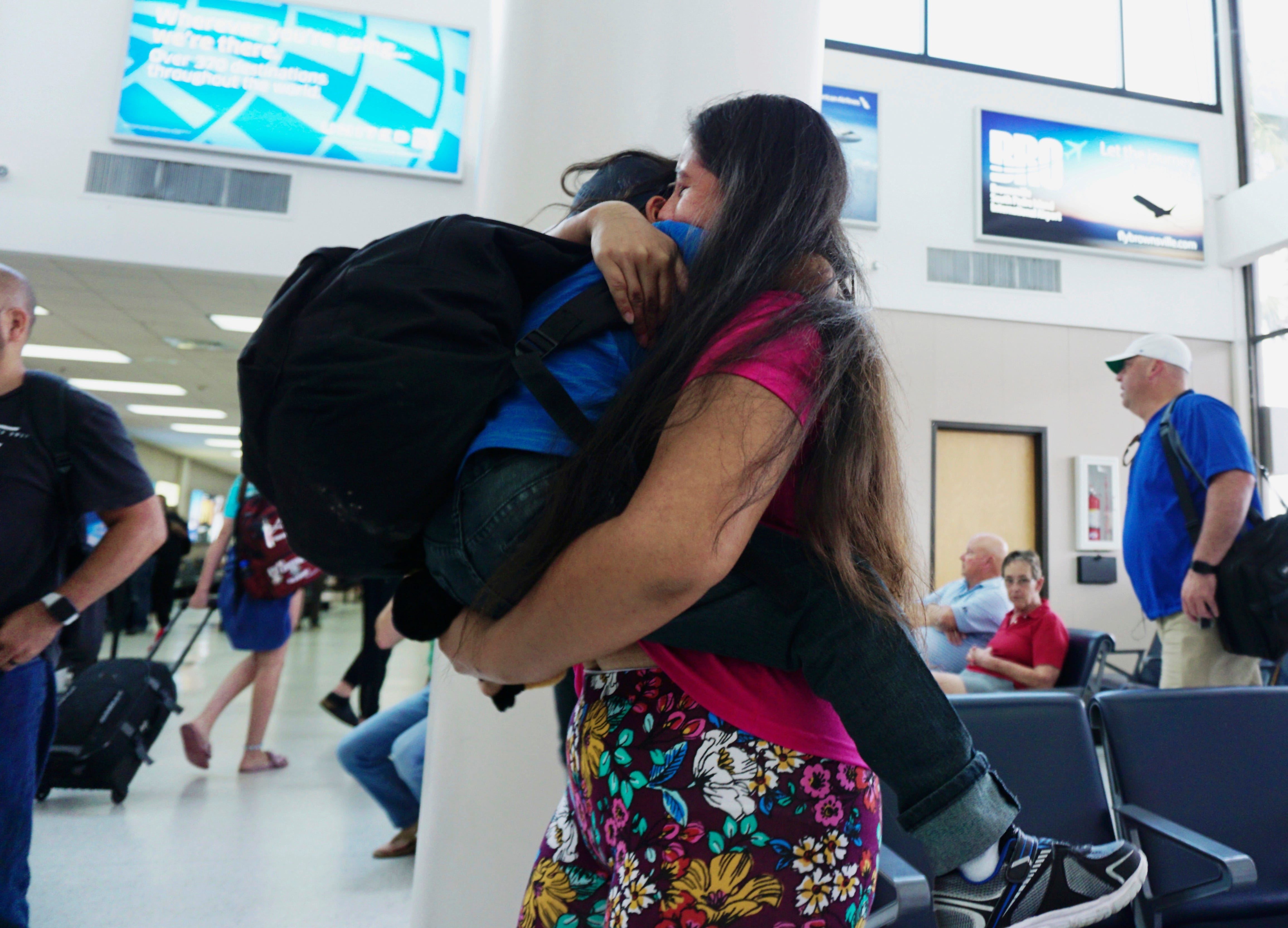 Twenty-four-year-old Dunia of Honduras embraces her 5-year-old son Wuilman at Brownsville South Padre Island International Airport in Brownsville, Texas, on July 20, 2018, as they were reunited after being separated from each other for more than 30 days. 