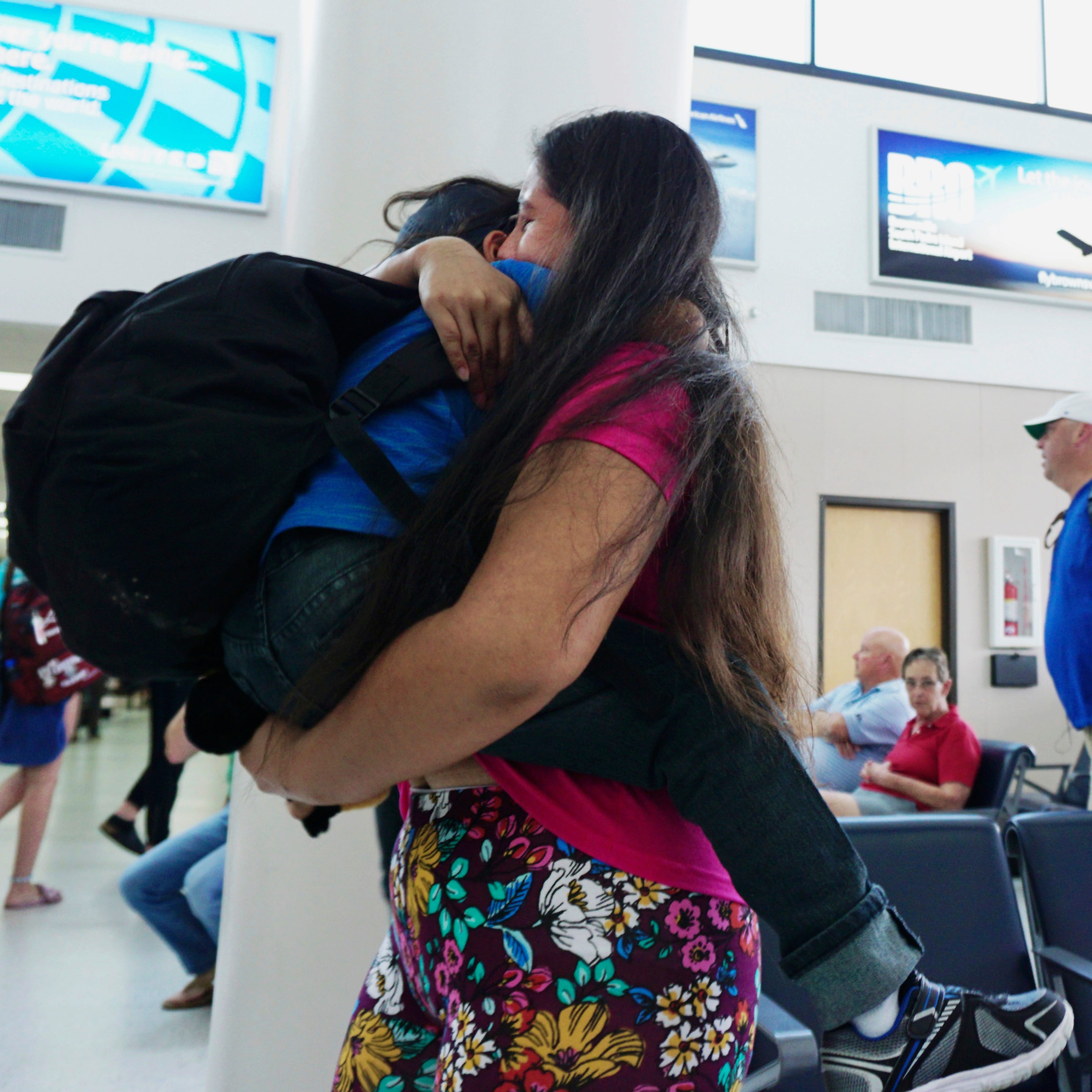Twenty-four-year-old Dunia of Honduras embraces her 5-year-old son Wuilman at Brownsville South Padre Island International Airport in Brownsville, Texas, on July 20, 2018, as they were reunited after being separated from each other for more than 30 d