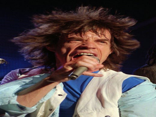 Rolling Stones lead singer Mick Jagger belts out "Shattered" during the group's VooDoo Lounge tour concert Tuesday night Nov. 22, 1994 at Tampa Stadium. (AP Photo/Chris O'Meara) ORG XMIT: TP108