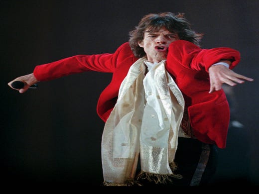 Mick Jagger performs during the Rolling Stones concert Thursday night, Oct. 16, 1997, at Giants Stadium in East Rutherford, N.J. (AP Photo/Bill Kostroun) ORG XMIT: ERA105
