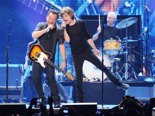 Musician Bruce Springsteen, left, performs with Mick Jagger of The Rolling Stones at the Prudential Center in Newark, NJ on Saturday, Dec. 15, 2012. (Photo by Evan Agostini/Invision/AP) ORG XMIT: NYEA110