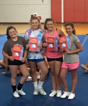 Four Riverheads Little League cheerleaders, from left, Kylee Swats, Leah Bryant, Emma Ambler and Ashlyn Almarode, were named Universal Cheerleaders Association All-Americans at a recent camp and will perform with other All-Americans at the 99th Thanksgiving Day Parade in Philadelphia, Pa. The camp was held July 9-13 at Riverheads High School.