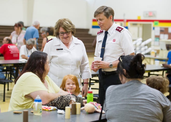New Salvation Army Majors Mark and Sandi Turner engage with lunch goers at the Salvation Army headquarters on Thursday, July 26, 2018.