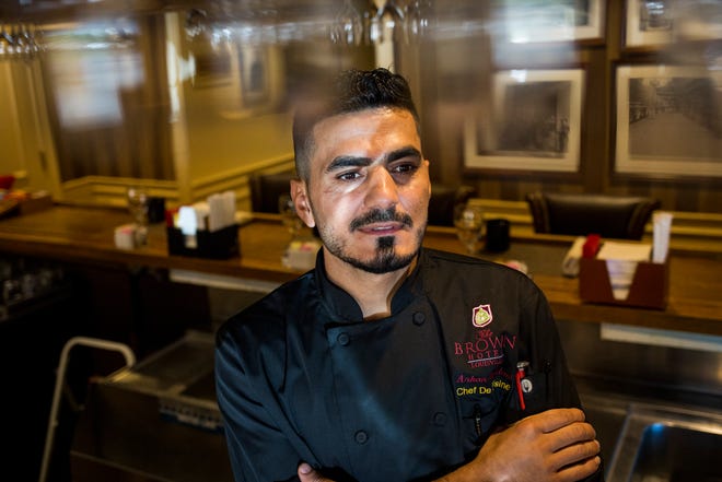 Chef Arkan Bajalani sits for a portrait int he dinning room of J. Graham's Cafe at the Brown Hotel in downtown Louisville on Wednesday, July 18, 2018. 