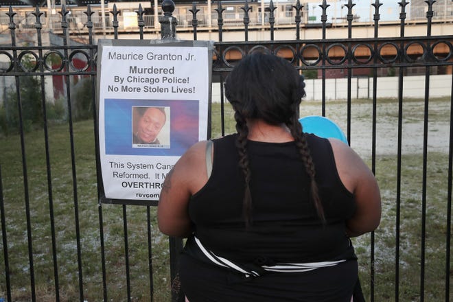 Tayshia Shaw mourns the loss of the father of her children, 24-year-old Maurice Granton Jr.,  during a vigil in the Bronzeville neighborhood of Chicago on June 7.