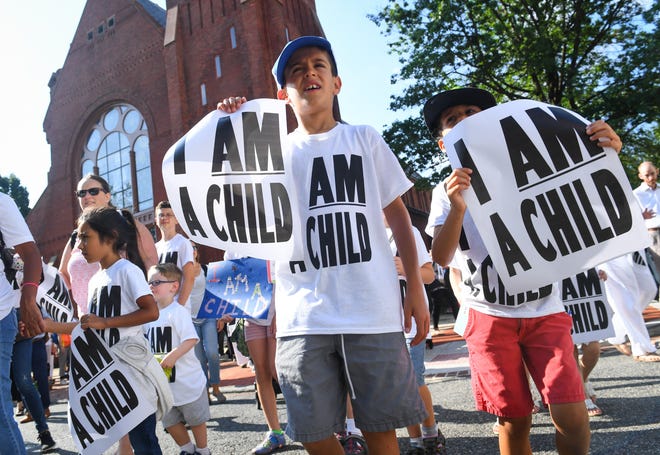Families with young children protest the separation of immigrant families with a march and sit-in at the Hart Senate Office Building, Thursday, July 26, 2018, on Capitol Hill in Washington.