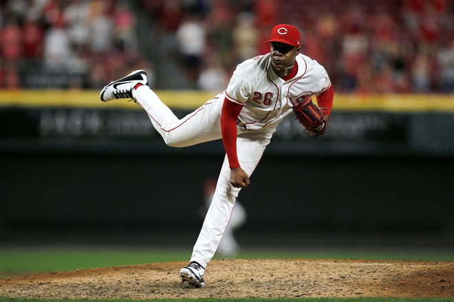 Cincinnati Reds relief pitcher Raisel Iglesias (26) throws a pitch in the top of the ninth inning of the MLB National League game between the Cincinnati Reds and the Philadelphia Phillies at Great American Ball Park in downtown Cincinnati on Friday, July 27, 2018. The Reds won 6-4.