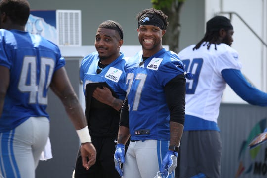 Safety Glover Quin talks with other players after the Detroit Lions training camp at their practice facility in Allen Park on Sat. July 28, 2018.