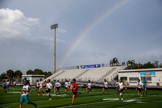 The Gulf Coast High School football team runs drills during the first day of practice under new head coach Tom Scalise at Gulf Coast in North Naples on Monday, July 30, 2018.