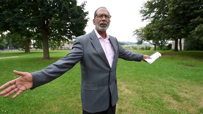 Eric Kirkland stands at the place where his house stood on Codorus Street in York prior to the demolition of the neighborhood between 1958-61. Kirkland describes the neighborhood as vibrant with businesses. His grandfather bought the house in 1925 and had paid it off by the time the neighborhood was demolished.