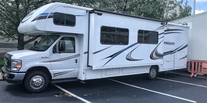 Cleveland Browns quarterbacks are using an RV as a place to relax and unwind during training camp. It sits in the players' parking lot.