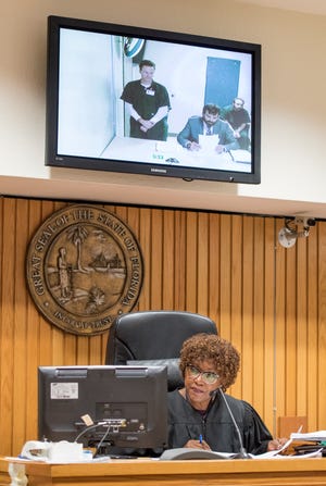 Henry Steiger makes his first appearance on video monitor before Judge Joyce Williams at the Escambia County courthouse in Pensacola on Thursday, August 2, 2018.