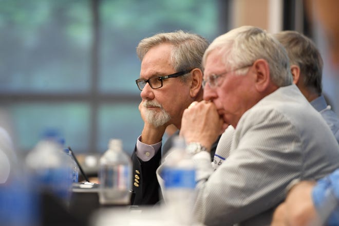 Highlands Mayor Patrick Taylor, left, and Franklin Mayor Bob Scott, right, are among several local officials expressing concerns about the degree to which rural hospitals would be protected if Mission Health is sold to HCA Healthcare. They are shown at an August seminar on the deal.