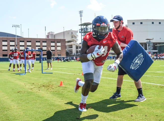 Ole Miss running back Eric Swinney (24) runs through a drill during NCAA college football practice in Oxford, Miss., Friday, Aug. 3, 2018.  (Bruce Newman, Oxford Eagle via AP)