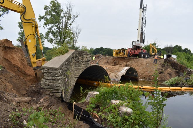 The bridge on Wixom Road over the Huron River is being replaced.