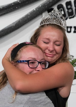 Hayley Clarkson emotionally hugs her sister Taylor Clarkson after being named the 2018 Jr. Fair queen  Sunday night.