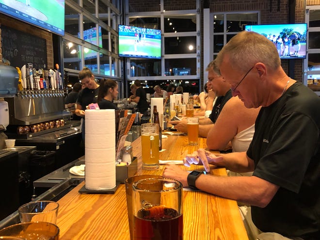 Double Dogs was packed during my Sunday night visit. Folks were lined up and down the indoor/outdoor bar, seated in cozy booths and trickling in and out of the dining area throughout the night.