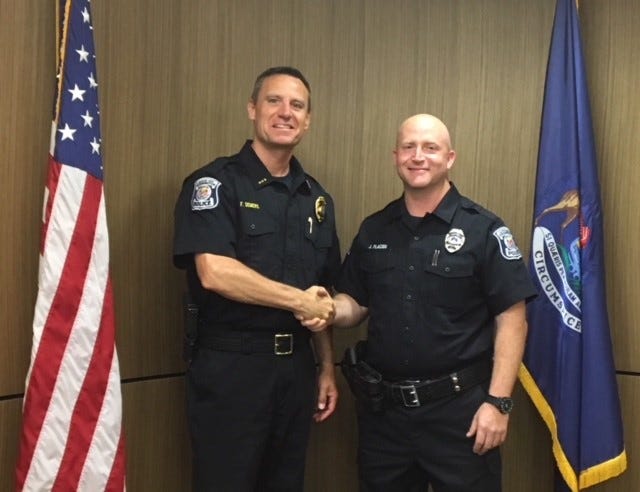Farmington Public Safety Director Frank Demers (left) with the department's newest officer, Joseph Placido.