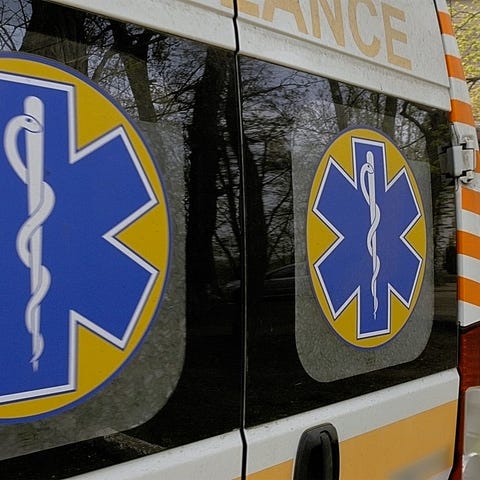 An ambulance waits at a hospital.