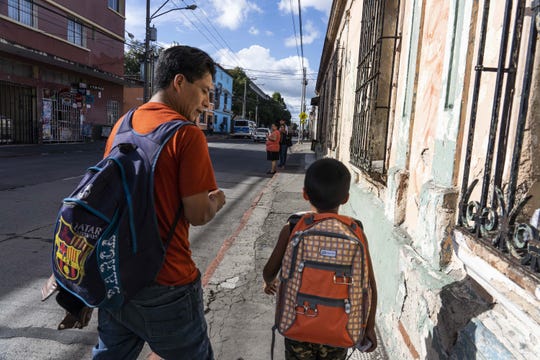 Gilberto Calmo and his son Franklin Noel Calmo Ramirez, 8, leave the shelter after they were reunited in Guatemala City on August 7, 2018. Calmo and his entered the U.S. on March 8 and were separated shortly after. Calmo was deported on June 8.