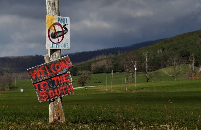 Hand painted signs along the roads near Bent Mountain, Virginia signal community opposition to the Mountain Valley Pipeline Project.