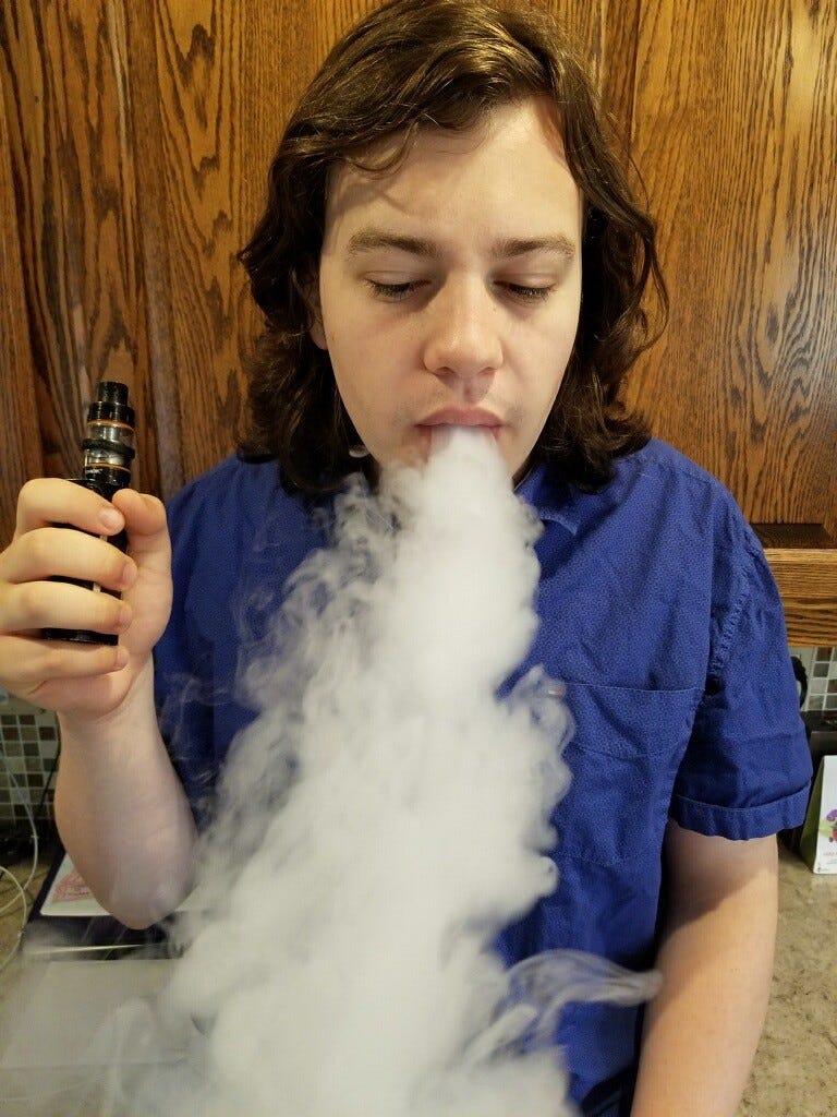 Spencer Re is shown vaping .