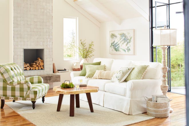 Colorful pillows perk up a white slipcovered sofa from Pier 1 Imports.