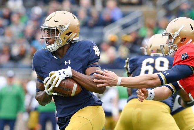 Apr 21, 2018; Notre Dame, IN, USA; Notre Dame Fighting Irish wide receiver Jafar Armstrong (8) takes a handoff from quarterback Ian Book (12) in the first quarter of the Blue-Gold Game at Notre Dame Stadium. Mandatory Credit: Matt Cashore-USA TODAY Sports