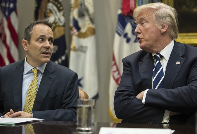 Kentucky Gov. Matt Bevin, left, an ally of President Donald Trump, has proposed that Medicaid recipients be subject to a work requirement to receive benefits.
 Carolyn Kaster/P
President Donald Trump, right, and Kentucky Governor Matt Bevin, left, talk during a prison reform roundtable in the Roosevelt Room of the Washington, Thursday, Jan. 11, 2018. (AP Photo/Carolyn Kaster)