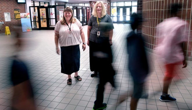 E. A. Cox Middle School guidance counselors Denise Owens and Kim Johnson stand in the hallway at the Columbia, Tenn., school on Tuesday, Aug. 7, 2018.  Maury County schools are among the first to adopt a new policy that requires school counselors to spend 80 percent of their time face to face with students.