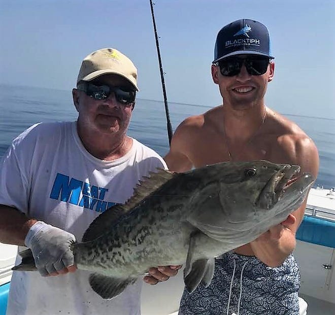 New York Mets outfielder Brandon Nimmo, right, caught a nice gag grouper and several kingfish Thursday while fishing aboard Slob City charters with Capt. Carl Torresson of Port St. Lucie.