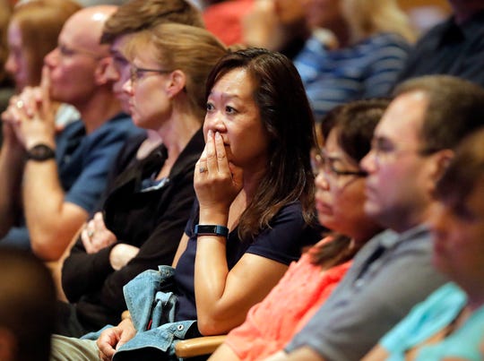 Audience members react as it was announced on Wednesday, Aug. 8, 2018, at Willow Creek Community Church in South Barrington, Illinois, that lead pastor Heather Larson is stepping down along with the church's board.