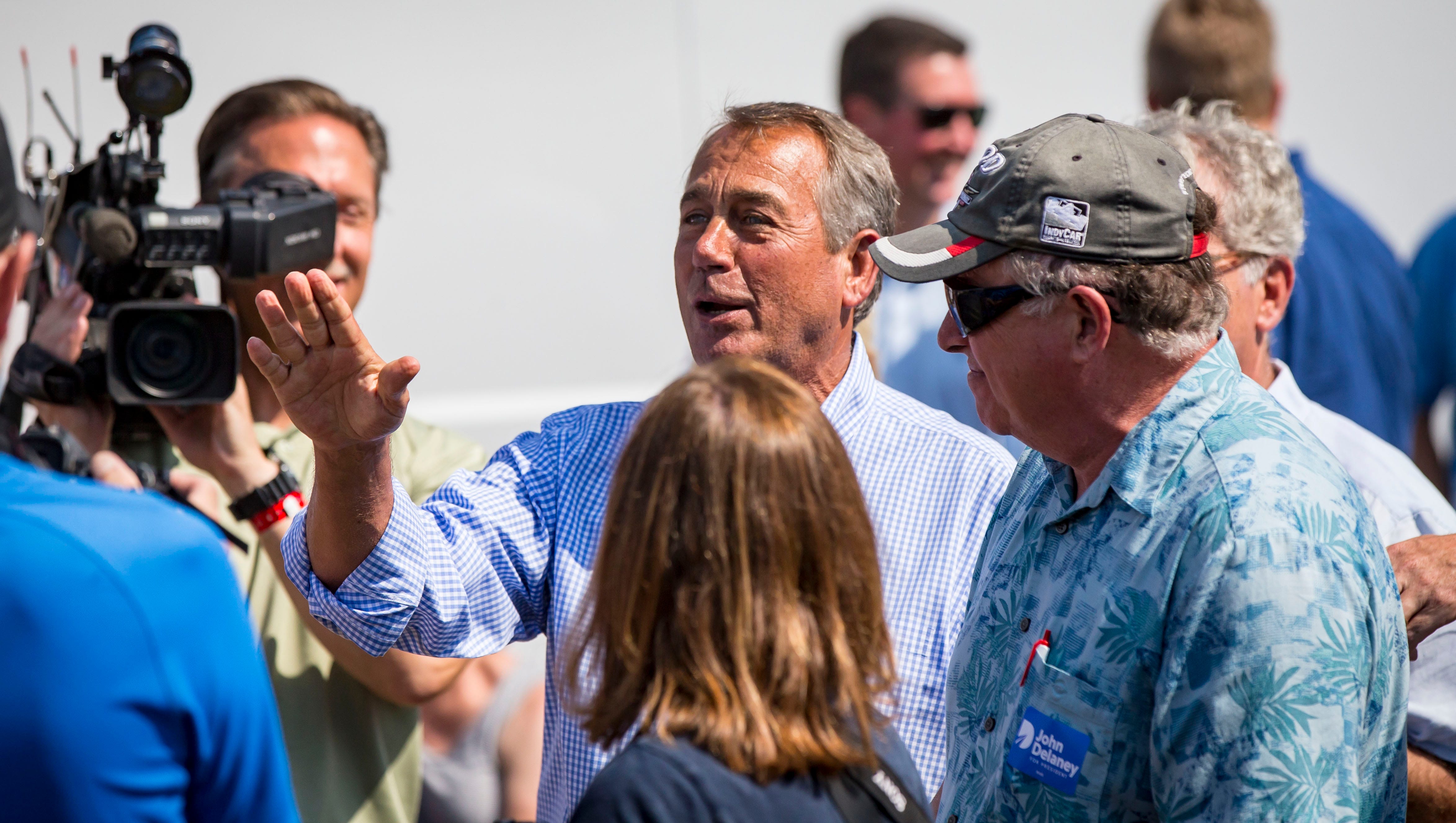 Former Speaker of the U.S. House of Representatives John Boehner talks with Democrat John Delaney, a presidential hopeful, at the Des Moines Register Political Soapbox at the Iowa State Fair on Friday, Aug. 10, 2018, in Des Moines, Iowa.