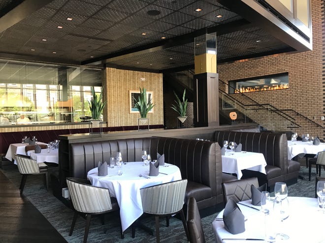 A brick wall hosting a glassed-in fireplace divides the main dining room from the bar at Anthony's Chophouse, an upscale steakhouse scheduled to open Aug. 13, 2018, at 201 W. Main St., Carmel.
