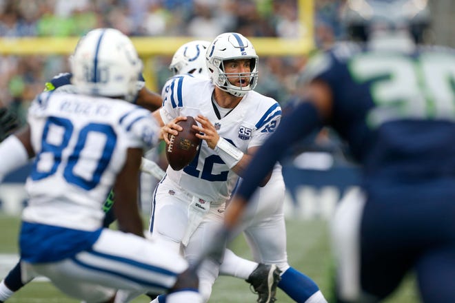 Indianapolis Colts quarterback Andrew Luck (12) looks to pass against the Seattle Seahawks during the first quarter at CenturyLink Field.