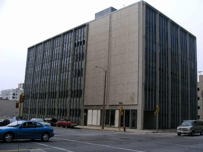 Two empty office buildings and a parking lot in downtown Milwaukee were sold to hotel developers for just over $5 million.