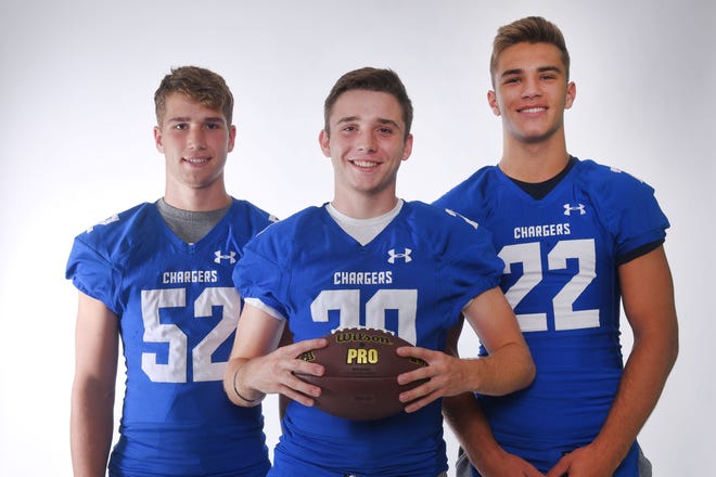 Sioux Falls Christian's Ryan Sjaarda, from left, Parker Nelson and Mitchell Goodbary during football media day Tuesday, Aug 7, at Argus Leader Media in Sioux Falls.