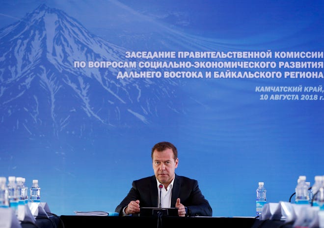 Russian Prime Minister Dmitry Medvedev speaks during a meeting in Kamchatka Peninsula region, Russian Far East, Russia,  Aug. 10, 2018. Russia's prime minister warned the United States  against ramping up sanctions, saying that Moscow will retaliate with economic, political and unspecified "other" means.