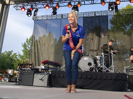 Audrey Campbell, Miss Fountain County and the 60th Indiana State Fair Queen introduces the headline act onto the stage. Hanson, a trio of siblings known for the No. 1 hit in 1997 titled "MMMBop" performed at the Indiana State Fair, Friday, Aug. 10, 2018, on the Chevrolet Free Stage.