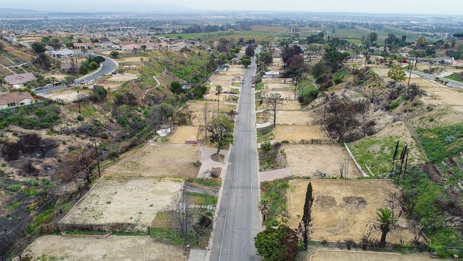 Empty lots where the Thomas Fire destroyed homes along Colina Vista in Ventura are shown in this May 23 photograph.