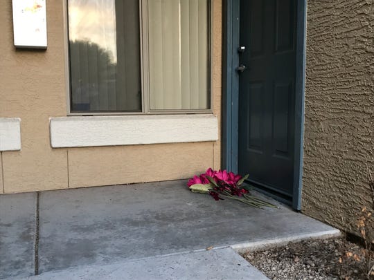Flowers are left on the doorstep of missing 19-year-old Kiera Bergman during her vigil in Phoenix on Aug. 11, 2018.