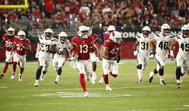 Arizona Cardinals Christian Kirk returns a punt against the L.A. Chargers in the first half during a preseason NFL football game on Aug. 11, 2018 at University of Phoenix Stadium in Glendale, Ariz.