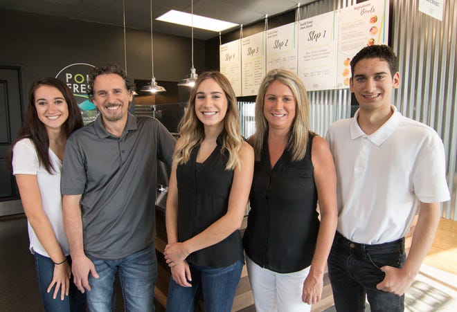 From left, daughter Morgan, dad Chris, daughter Kylie, mom Tracy and son Chris Bachuwa, shown Monday, Aug. 13, 2018, all contributed to the formation of Poké Fresh, a Hawaiian cuisine-inspired restaurant business with locations in Genoa Township and Brighton.