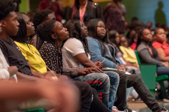 During an assembly on Monday, students at Booker T. Washington High School listen to a talk from Rev. Jesse Jackson.