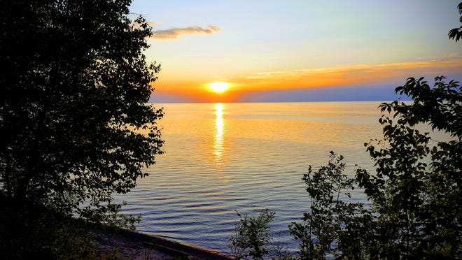 The sun sets over Lake Superior near the Porcupine Mountains Wilderness State Park in Michigan's Upper Peninsula. This fall marks the 10th anniversary of the Great Lakes Compact, an international water protection agreement.