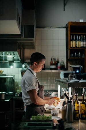 Executive Chef Alex McPhail in the open kitchen of IRON in downtown Pensacola.