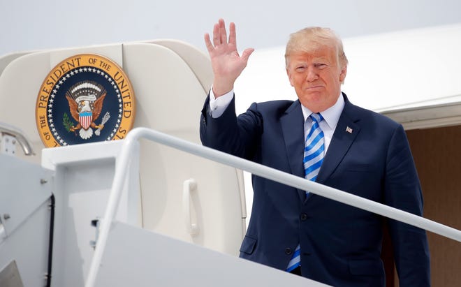 President Donald Trump waves as he arrives on Air Force One at Wheeler-Sack Army Air Field in Fort Drum, N.Y., Monday, Aug. 13, 2018. (AP Photo/Carolyn Kaster)