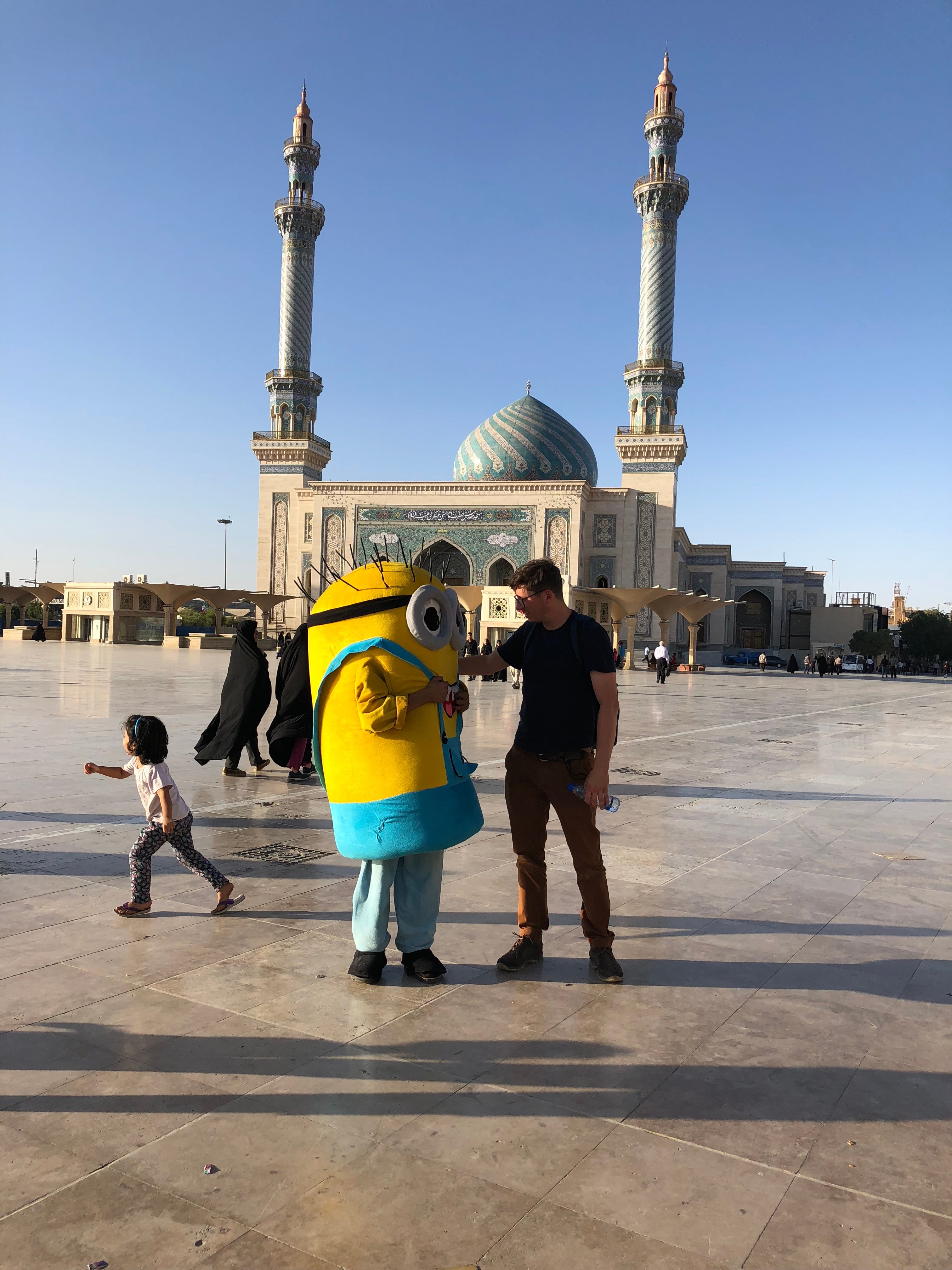 USA TODAY reporter Kim Hjelmgaard greets a child dressed in a Minion costume from the 2015 animated comedy film, in Qom, Iran, on July 12, 2018.