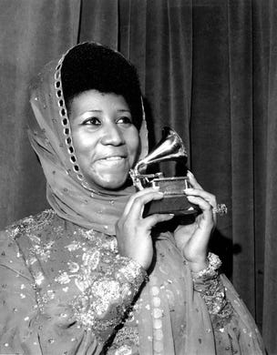 Singer Aretha Franklin poses with her Grammy Award at the 17th Annual Grammy Award presentation in New York on March 3, 1975. The award is for her performance in "Ain't Nothing Like the Real Thing." Franklin has won every Grammy Award for "Best Rhythm and Blues Performance, Female" since this category was created in 1968. (AP Photo)