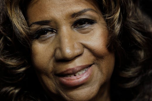 ORG XMIT: NY115 FILE - In this Feb. 11, 2011 file photo, Aretha Franklin smiles after the Detroit Pistons-Miami Heat NBA basketball game in Auburn Hills, Mich. Franklin, who says she's back at "150 percent," is planning to return to the stage in May for her first post-surgery performance. (AP Photo/Paul Sancya)